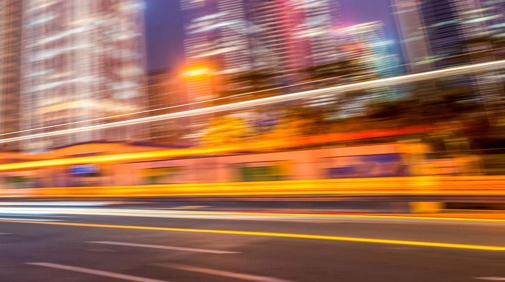 Blurred time series image of street at night