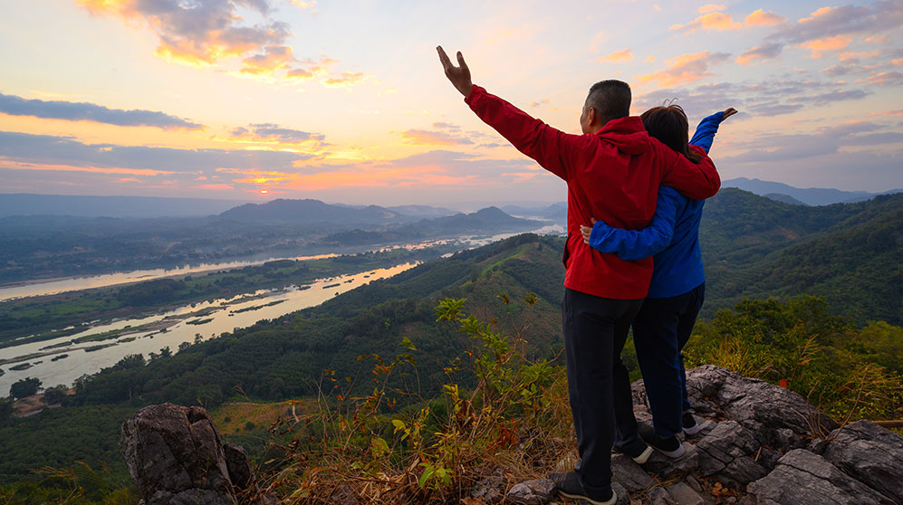 Older couple on the top of a mountain