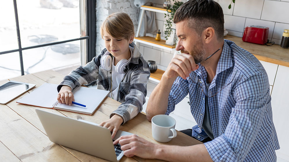 father teaching his son about saving money